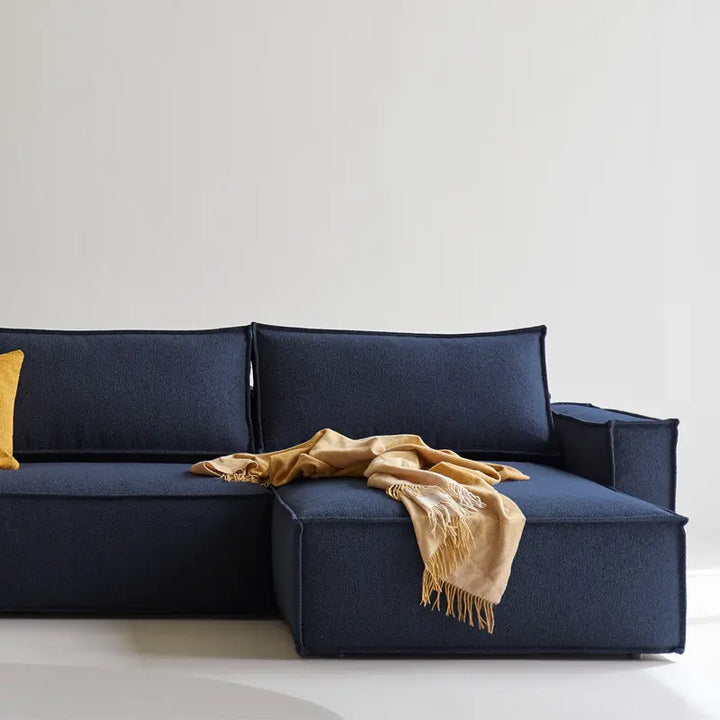 Play sofa bed with chaise, close up of the chaise. Navy blue fabric